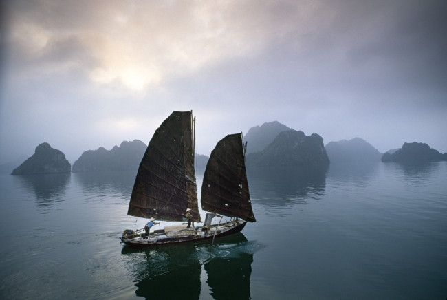 Catherine says travel photojournalism can only be learned by shooting on location: Traditional fishing junks in Halong Bay have become a rarity.