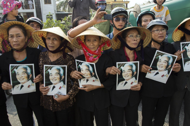 The funeral procession of General Giap; thousands were holding Catherine Karnow’s photo