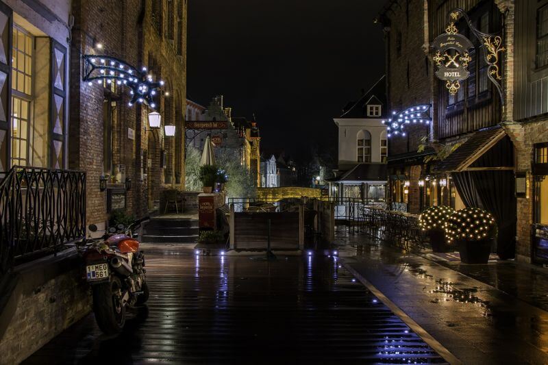 Christmas lights in an alley outside