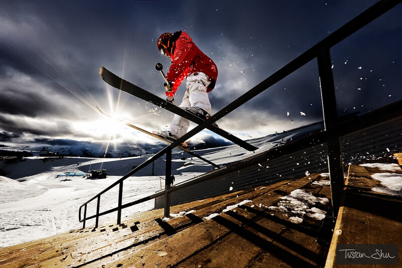 Skier grinding down staircase in SnowParkNZ, New Zealand