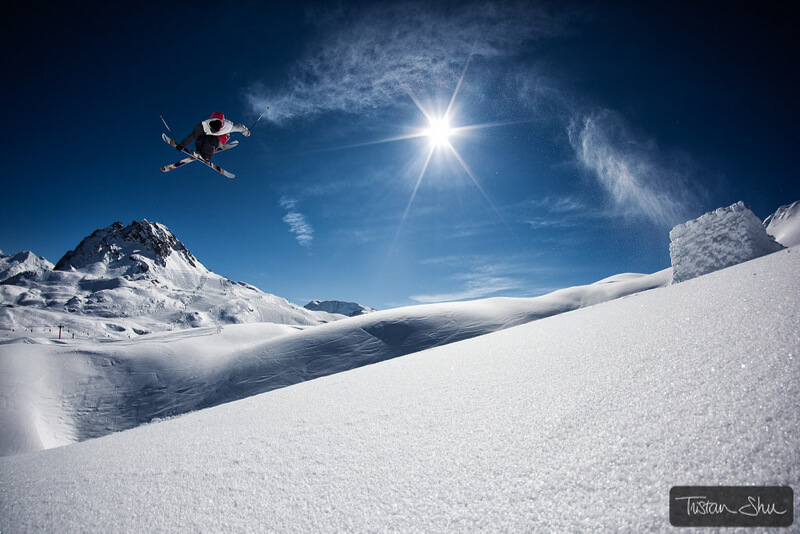 Skier jumping off a backcountry kicker