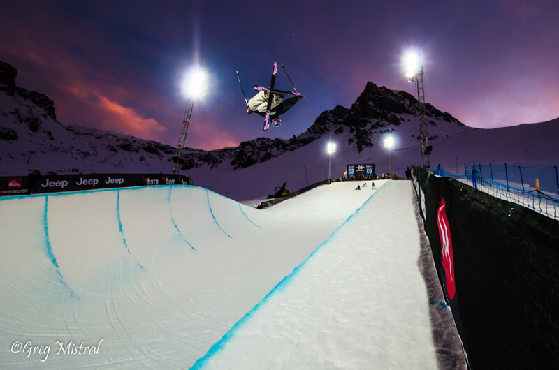 Skier in the half-pipe at sunset