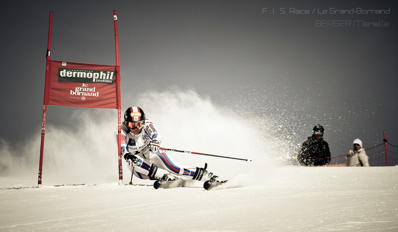 Competitive skier going down a slope