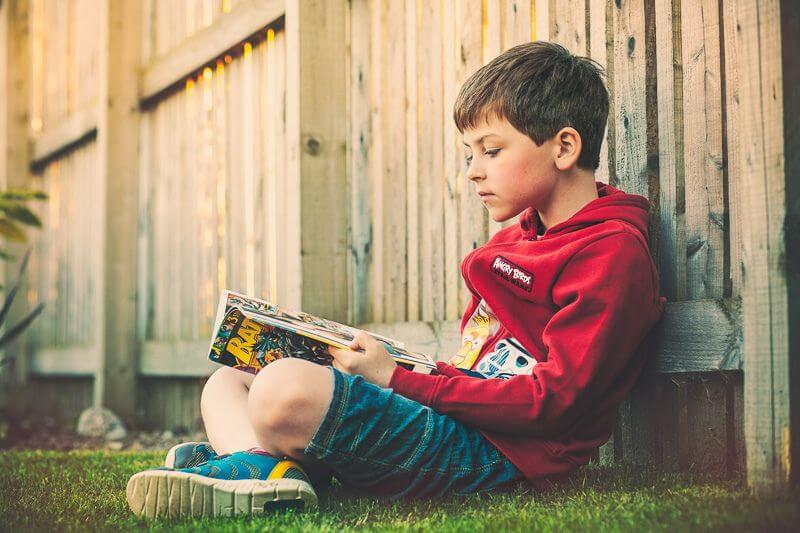 Greig Reid Son reading Batman comic