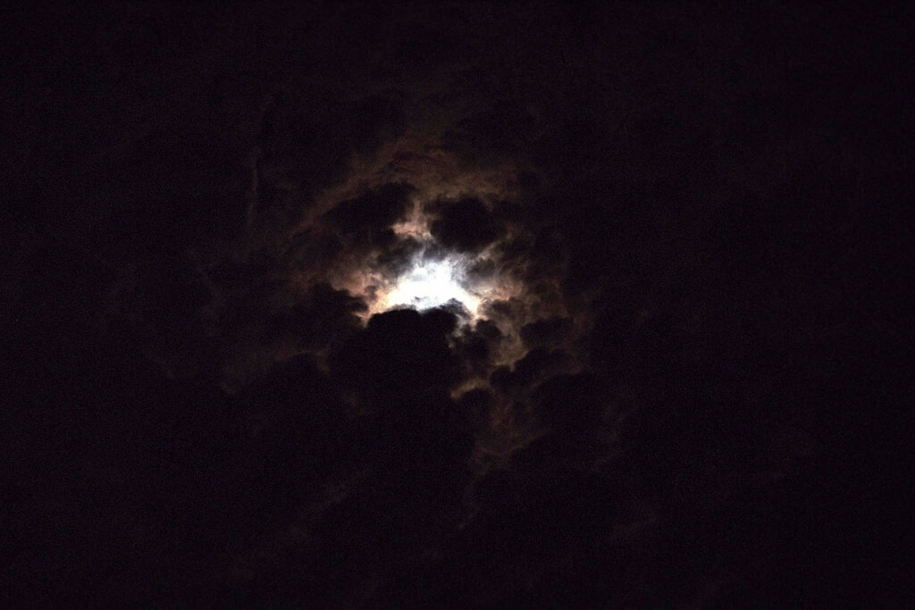 moon behind clouds