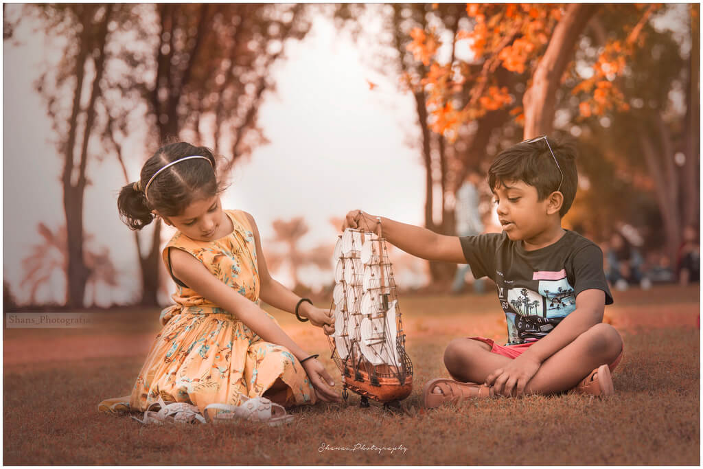 shanavas - girl and boy playing with boat