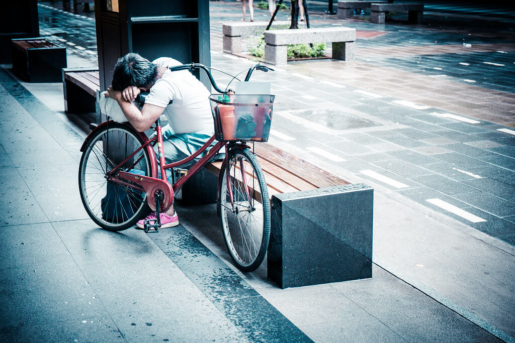 Bryon Lippincott - sleeping on bicycle